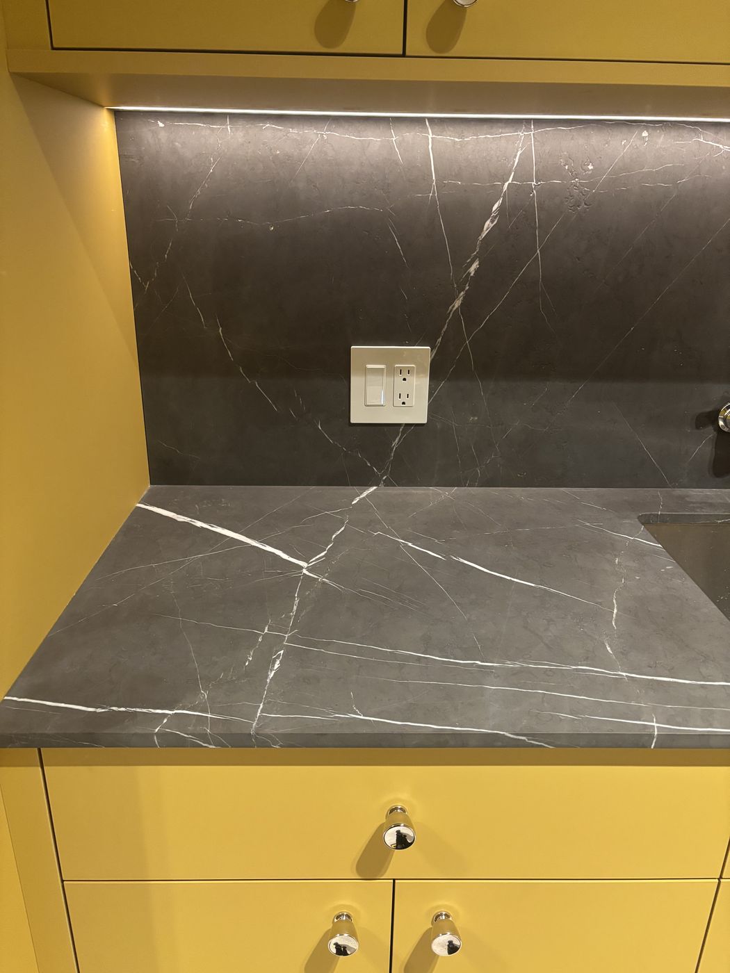 Under cabinet lighting on wood vanity